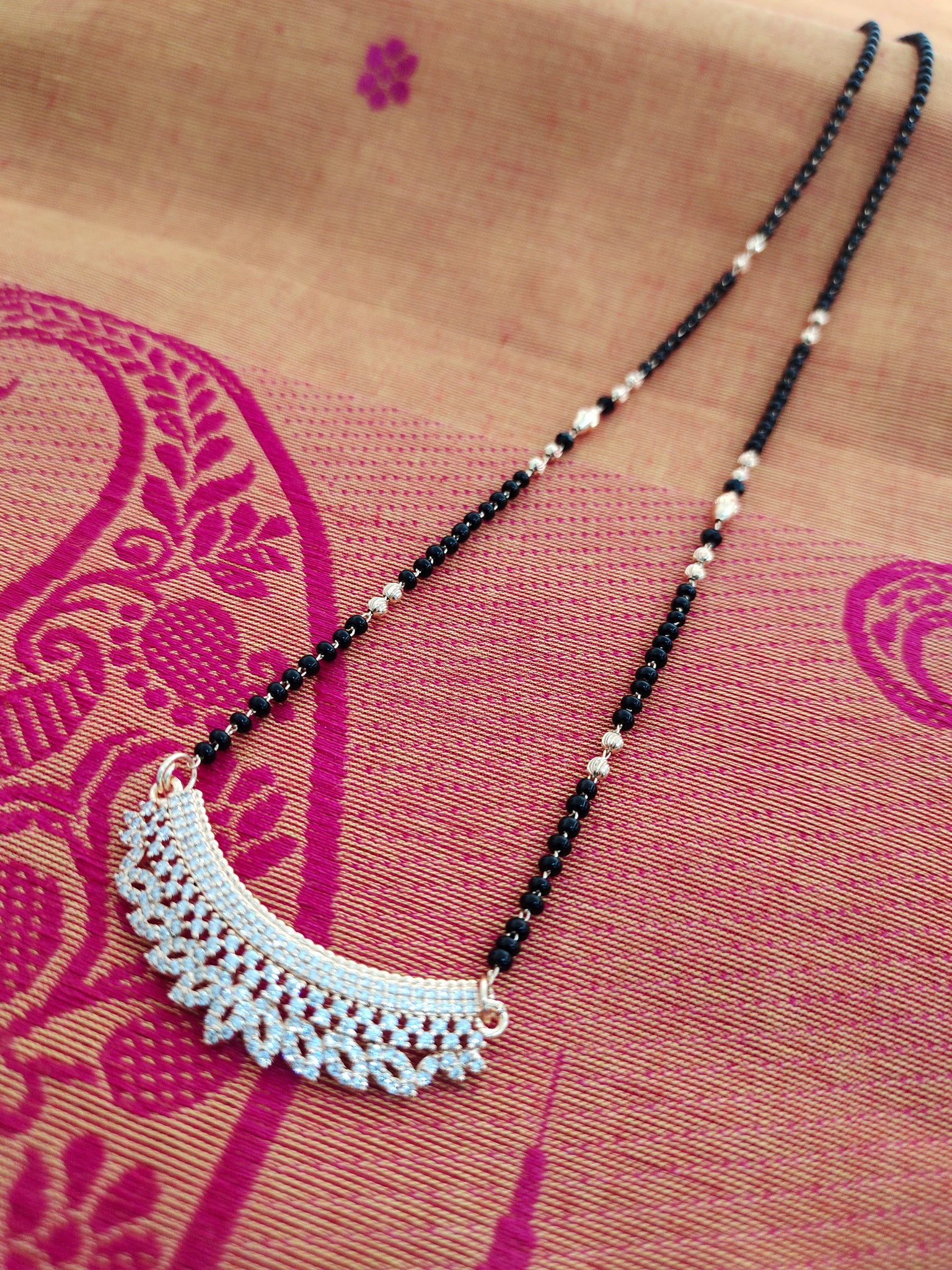 Black bead chain with small AD pendant